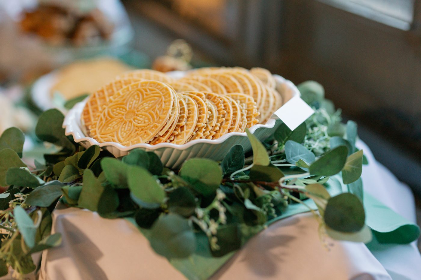 Pizzelle stacked in a dish